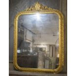WALL MIRROR, circa 1860, Spanish, giltwood and gesso with rounded rectangular vine decorated frame