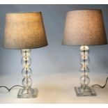 TABLE LAMPS, a pair, glass each with a column of glass balls and square base (with shades), 64cm