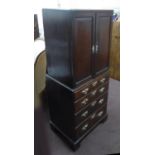 CABINET ON CHEST, Georgian oak with two panelled doors enclosing ten drawers above a base with