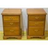 BEDSIDE CHESTS, a pair, fruitwood, with three drawers, 68cm H x 47cm W x 46cm D. (2)