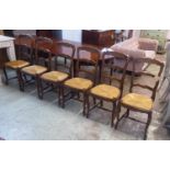 FARMHOUSE CHAIRS, a set of six, Louis XV style beechwood, each with a ladder back and a drop in rush