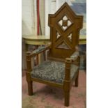 OPEN ARMCHAIR, Victorian Gothic revival oak with quatrefoil pierced back and grey damask upholstery,