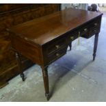 WRITING TABLE, George IV mahogany with five drawers and reeded turned supports, 106cm W x 54cm D x