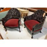 ARMCHAIRS, a pair, black lacquer of Burmese design with foliate pierced backs and burgundy velvet