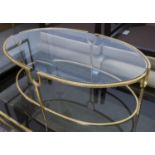LOW TABLE, Maison Jansen style, gilt metal with oval glass top, 59cm x 97cm x 38cm.