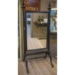 CHEVAL MIRROR, 19th century French ebonised with a pair of flared fluted columns and a swing mirror,