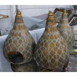 MOROCCAN STYLE LANTERNS, a set of three, tier drop design, glass inserts, 62cm H approx. (3)