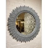 STARBURST WALL MIRROR, 1960's design, carved and painted wood, 92cm diam.