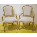 FAUTEUILS, a pair, Louis XV style oak, in taupe upholstery, 61cm W.