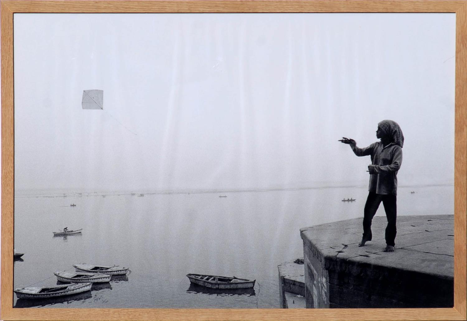 KITE FLYER IN VARANASI, photograph, signed and numbered, 53cm x 80cm, framed and glazed.