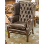 WING ARMCHAIR, Georgian style with cushion seat in dark brown leather, 111cm H x 79cm.