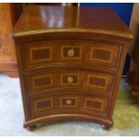 CHEST, having a concave front with three short drawers below on bun feet, 61cm W x 73cm H x 48cm