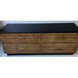 CHEST, 1970's of four drawers with slatted front and sides and black top and plinth, 183cm x 57cm