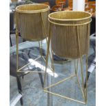 PLANT STANDS, a pair, with pots on metal supports, 50.5cm H. (2)