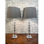 HEATHFIELD & CO TABLE LAMPS, a pair, each with a column of glass balls and square chrome base,