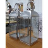 LANTERNS, a set of three, Contemporary polished metal finish, 62cm H. (3)