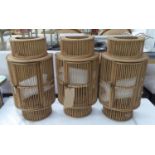 BAMBOO WALL HANGING CANDLE LANTERNS, a set of three, with glass inserts, 55cm H. (3)