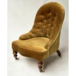 SLIPPER CHAIR, Victorian, walnut, of compact size, with buttoned antique, golden yellow velvet,