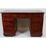 PEDESTAL DESK, Victorian mahogany, with tooled green leather top over an arrangement of nine