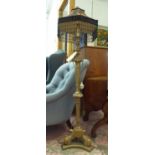 FLOOR LAMP, gilt metal with tasseled shade, 150cm H.