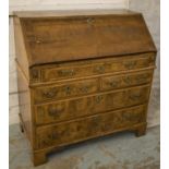 BUREAU, George II walnut and featherbanded with fitted interior over five drawers, 50cm x 98cm H x