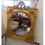 WALL MIRROR, gilt with a scrolled surmount and a circular bevelled plate, 78cm W x 95cm H.