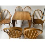 ATTRIBUTED TO ERCOL WINDSOR DINING CHAIRS AND PLANK TABLE BY LUCIAN ERCOLANI, including six chairs