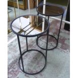 SIDE TABLES, a pair, contemporary black metal, mirrored tops, 65cm H x 40cm diam. (2)