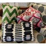 CUSHIONS, a set of four, various sizes. (4)