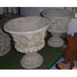 GARDEN URNS, a pair, composite stone with foliate detail, 58cm H x 51cm diam. (2)