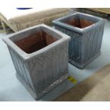 PLANTERS, a set of four, dusty blue glazed including two pairs of differing heights, 43cm at