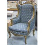 BERGERE, Louis XV style giltwood with cushion seat in floral patterned blue upholstery, 123cm H x