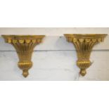 WALL SCONCES/UPLIGHTERS, a pair, gilt resin of tapering form, 38cm H x 32cm W. (2)