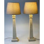 TABLE LAMPS, a pair, square tapering travertine marble columns with square plinths and shades,