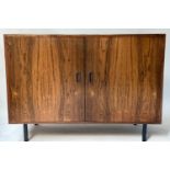 SIDE CABINET, 1970's Danish style rosewood with two panelled doors and splay ebonised supports,