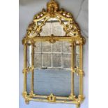 WALL MIRROR, mid 18th century style French carved giltwood with c scroll crest and pierced elaborate