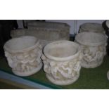 PLANTERS, a set of four, with putti detail, composite stone, 33cm H x 40cm diam. (4)