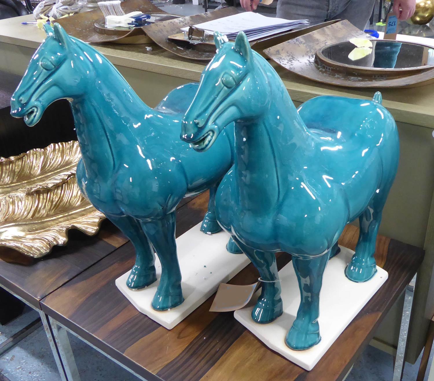 TANG STYLE HORSES, a pair, glazed finish, 51cm at tallest. (2)