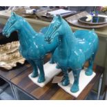 TANG STYLE HORSES, a pair, glazed finish, 51cm at tallest. (2)