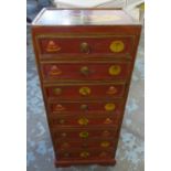 NARROW CHEST, red lacquered and fruit decorated with eight short drawers, 41cm W x 102cm H x 29cm D.