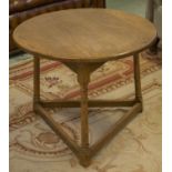 LOW TABLE, Arts and Crafts style oak with circular top, 51cm H x 65cm.