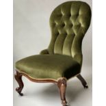 SLIPPER CHAIR, Victorian walnut with spoon shaped deep buttoned royal green velvet upholstery.