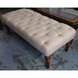 FOOTSTOOL, with an upholstered buttoned top on turned supports, 113cm L x 54cm D x 42cm H.