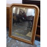 WALL MIRROR, 19th century French distressed giltwood and gesso, with an arched incised frame and