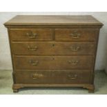 CHEST, George III oak, of two short and three long drawers, 105cm H x 120cm x 58cm. (with faults)