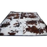 BOVINE HIDE FLOOR RUG, contemporary (with slight faults).