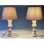 TABLE LAMPS, a pair, early 20th century with marble columns, gilt metal mounted with shades, 42cm H.