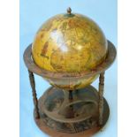 GLOBE COCKTAIL CABINET, modelled as an antique terrestrial globe on stand with rising lid.