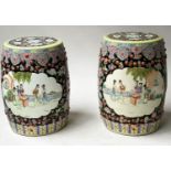 CHINESE STOOLS, a pair, Chinese pierced ceramic of barrel shape with opposing panels depicting