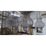 HANGING CANDLE LANTERNS, a set of six, wire work design, glass inserts, 85cm drop. (6)